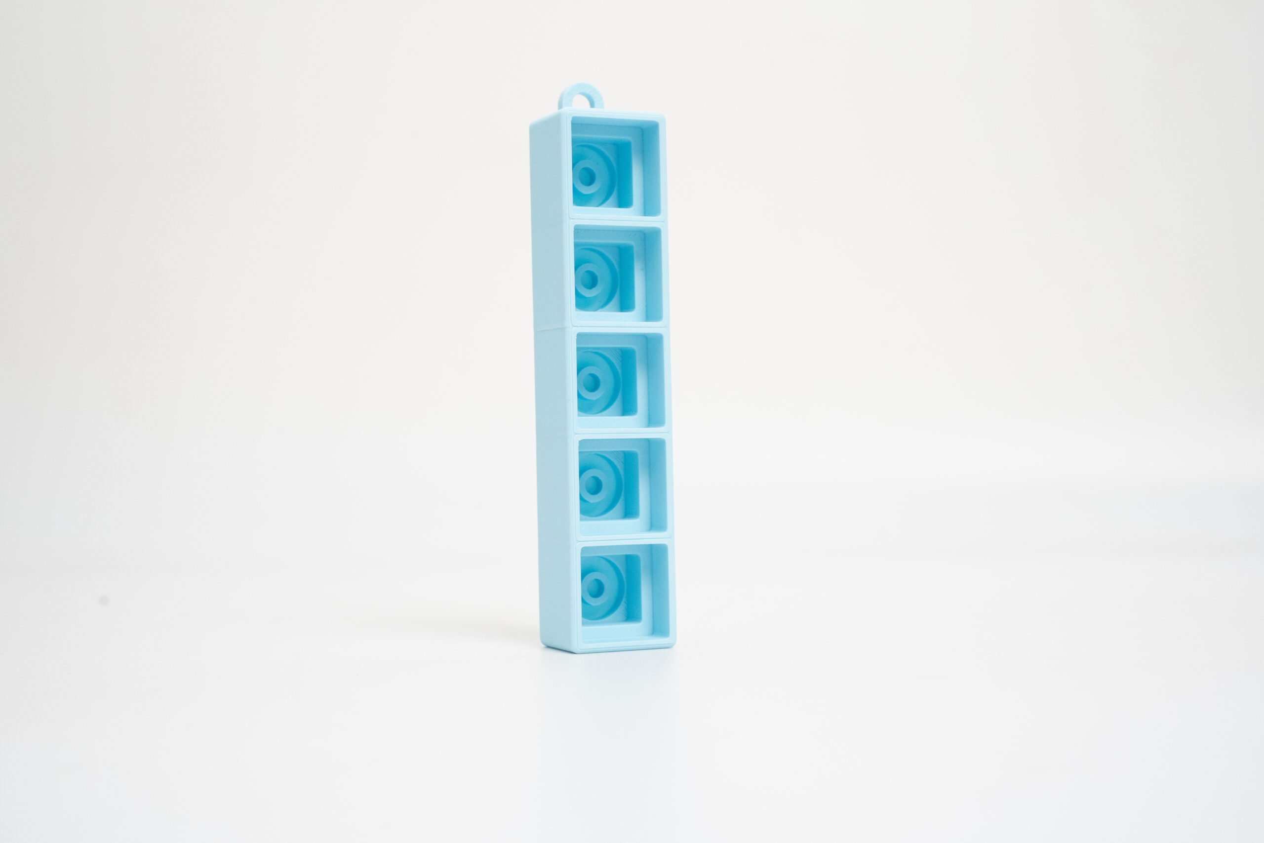 Layr 3D Fidget Clicker 1×5 in blue, 3D printed keycap fidget keychain with 5 keys